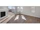 Bright living room featuring hardwood floors, a fireplace, and sliding glass doors at 1815 Chaffee Crest Dr, Berthoud, CO 80513
