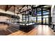 Upscale clubhouse bar with large windows and modern lighting at 1815 Chaffee Crest Dr, Berthoud, CO 80513