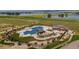 Resort-style pool and spa with surrounding landscaping at 1815 Chaffee Crest Dr, Berthoud, CO 80513