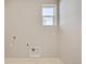 Laundry room with window and space for washer and dryer at 1815 Chaffee Crest Dr, Berthoud, CO 80513