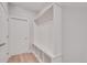 Bright hallway with built-in storage and hardwood floors at 1815 Chaffee Crest Dr, Berthoud, CO 80513