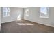 Bright bedroom with neutral carpeting and large windows at 1815 Chaffee Crest Dr, Berthoud, CO 80513