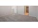 Bedroom with carpet, closet, and access to hallway at 21124 E 63Rd Dr, Aurora, CO 80019