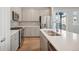 Modern kitchen with stainless steel appliances and an island at 21124 E 63Rd Dr, Aurora, CO 80019