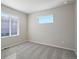 Bright bedroom with neutral walls, carpet flooring, and large window at 21124 E 63Rd Dr, Aurora, CO 80019