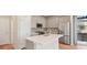 Modern kitchen with stainless steel appliances and a kitchen island at 21124 E 63Rd Dr, Aurora, CO 80019