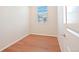 Bright bedroom with hardwood floors and a window at 21124 E 63Rd Dr, Aurora, CO 80019