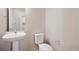Clean and simple bathroom with pedestal sink at 21124 E 63Rd Dr, Aurora, CO 80019