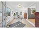 Home office with open view to kitchen and brick accent wall at 4109 S Acoma St, Englewood, CO 80110