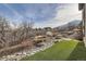 Landscaped backyard with artificial turf and rock features at 11364 Birolli Pl, Littleton, CO 80125