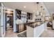 Basement bar with granite countertop and wine storage at 11364 Birolli Pl, Littleton, CO 80125