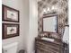 Powder room with patterned tile and rustic vanity at 11364 Birolli Pl, Littleton, CO 80125