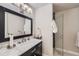 Basement bathroom with marble vanity and glass shower at 11364 Birolli Pl, Littleton, CO 80125