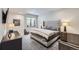 Spacious bedroom with king-size bed and large window, offering ample light at 11364 Birolli Pl, Littleton, CO 80125