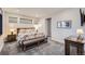 Guest bedroom with floral bedding and wood bench at 11364 Birolli Pl, Littleton, CO 80125