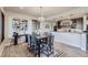 Dining area with table and chairs adjacent to a wet bar at 11364 Birolli Pl, Littleton, CO 80125
