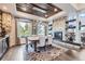 Elegant dining room with stone fireplace and wood ceiling at 11364 Birolli Pl, Littleton, CO 80125