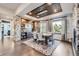 Modern dining room with stone accent wall and wood ceiling at 11364 Birolli Pl, Littleton, CO 80125