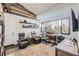 Dedicated home office with built-in shelving, comfortable seating, and natural light at 11364 Birolli Pl, Littleton, CO 80125