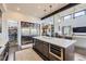 Gourmet kitchen boasts expansive island, stainless steel appliances, and ample storage at 11364 Birolli Pl, Littleton, CO 80125