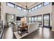 Bright living room with hardwood floors, high ceilings, and access to balcony at 11364 Birolli Pl, Littleton, CO 80125