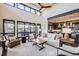 Spacious living room features high ceilings, large windows, and comfortable seating at 11364 Birolli Pl, Littleton, CO 80125