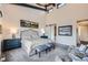 Spacious main bedroom with sliding barn door to en-suite bathroom at 11364 Birolli Pl, Littleton, CO 80125