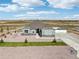 Aerial view of a house and surrounding neighborhood, showcasing the property's location and community at 9935 E 163Rd Pl, Brighton, CO 80602