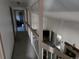 Upstairs hallway overlooking living area at 7507 Braun St, Arvada, CO 80005