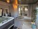 Hot tub room with access to backyard, gray walls, and a wooden ceiling at 7507 Braun St, Arvada, CO 80005