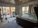 Hot tub room with access to backyard and a wooden ceiling at 7507 Braun St, Arvada, CO 80005