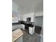 Modern kitchen with stainless steel appliances and wood countertops at 4538 S Nucla St, Aurora, CO 80015