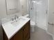 Bathroom with single sink vanity and shower at 2911 W Long Dr # D, Littleton, CO 80120