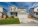 Two-story house with landscaped yard and attached garage at 27431 E 10Th Dr, Aurora, CO 80018