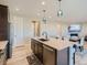 Eat-in kitchen with island, stainless steel appliances, and open floor plan at 27431 E 10Th Dr, Aurora, CO 80018