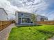 Landscaped backyard with grassy area and privacy fence at 27431 E 10Th Dr, Aurora, CO 80018
