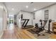 Home gym with treadmill, weight bench, and plenty of floor space at 54333 E County Road 26, Strasburg, CO 80136