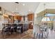 Open concept kitchen with island seating, dining area, and views at 54333 E County Road 26, Strasburg, CO 80136