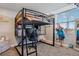 Charming bedroom with a built-in loft bed and workspace at 54333 E County Road 26, Strasburg, CO 80136