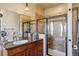 Bathroom with walk-in shower and double vanity at 54333 E County Road 26, Strasburg, CO 80136