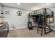 Basement bedroom with loft bed and workspace at 54333 E County Road 26, Strasburg, CO 80136