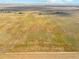 Aerial view of a property with large land area at 54333 E County Road 26, Strasburg, CO 80136