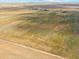 Aerial view of property showcasing large land area at 54333 E County Road 26, Strasburg, CO 80136
