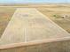 Aerial view of property with large land area at 54333 E County Road 26, Strasburg, CO 80136