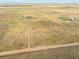 Aerial view showing a house and surrounding land at 54333 E County Road 26, Strasburg, CO 80136