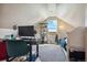 Bright bedroom with a desk setup, window, and twin bed at 54333 E County Road 26, Strasburg, CO 80136
