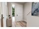Bright and airy entryway with light wood floors and access to the backyard at 1736 W 166Th Ave, Broomfield, CO 80023