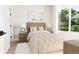 Cozy bedroom with a wooden headboard and large window at 1736 W 166Th Ave, Broomfield, CO 80023
