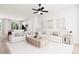 Open concept living room with adjacent kitchen and large windows at 1736 W 166Th Ave, Broomfield, CO 80023