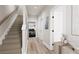 Light-filled hallway with access to the garage and upper level at 1736 W 166Th Ave, Broomfield, CO 80023